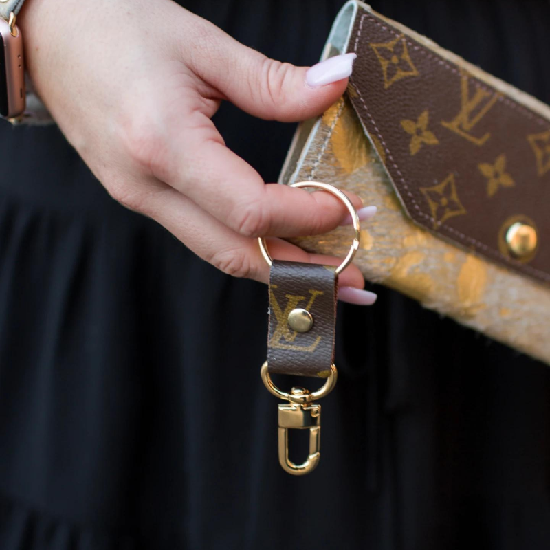 LV Keychain in model's hand